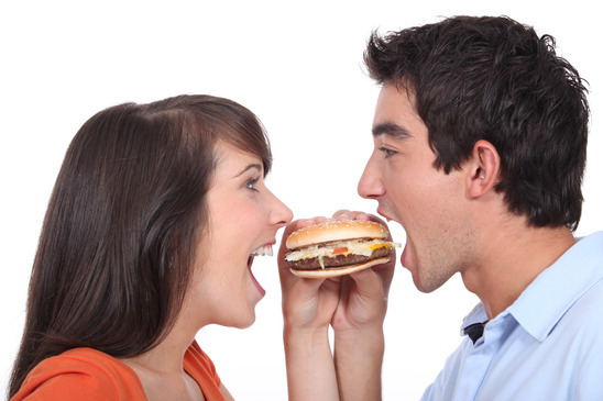 couple eating hamburger